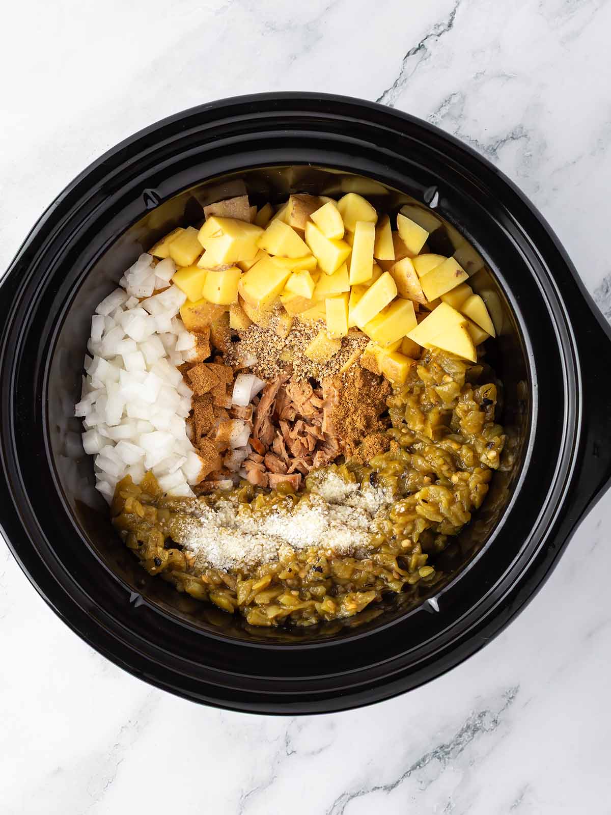 All ingredients in a crockpot before cooking.